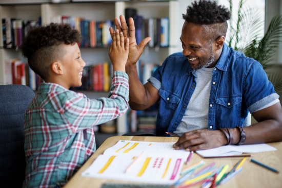 father helping son with homework 2.png